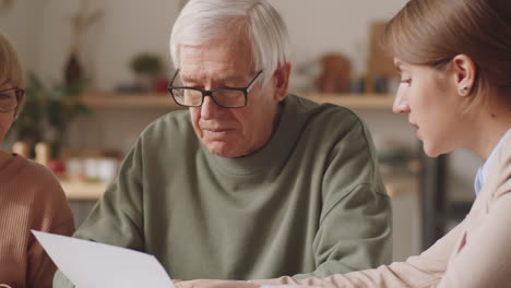 Senior-Couple-Having-Meeting-with-Financial-Consultant-at-Home